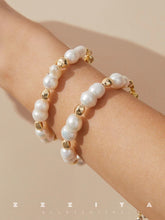 wearing Charlotte Pearl Bracelet